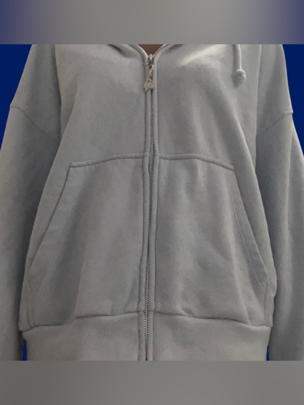 Light blue hoodie with Black graphic of Olivia Rodrigo’s GUTS artwork